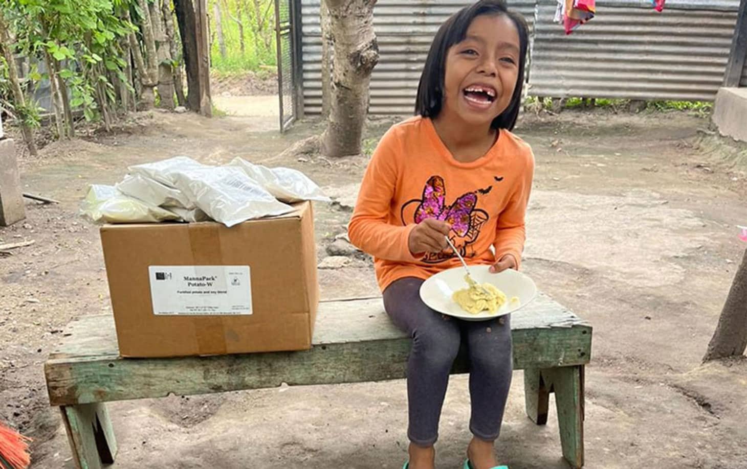 Happy Child Eating Meal