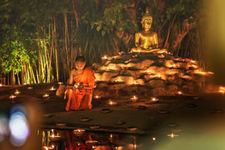 Buddhist with Candle